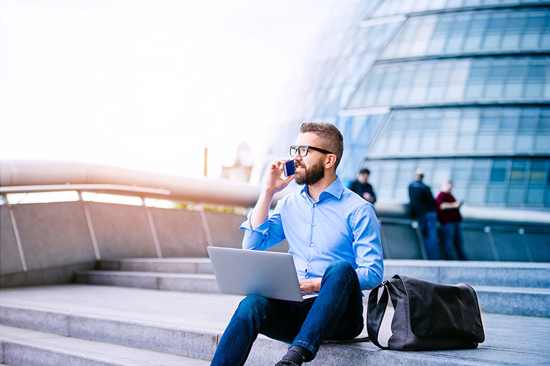 male worker conducting business using cloud software