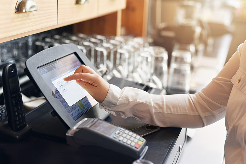 waitress entering an order on a pos system
