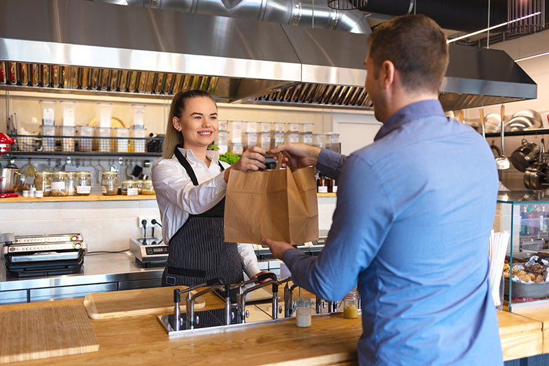 retail shop owner completing a transaction