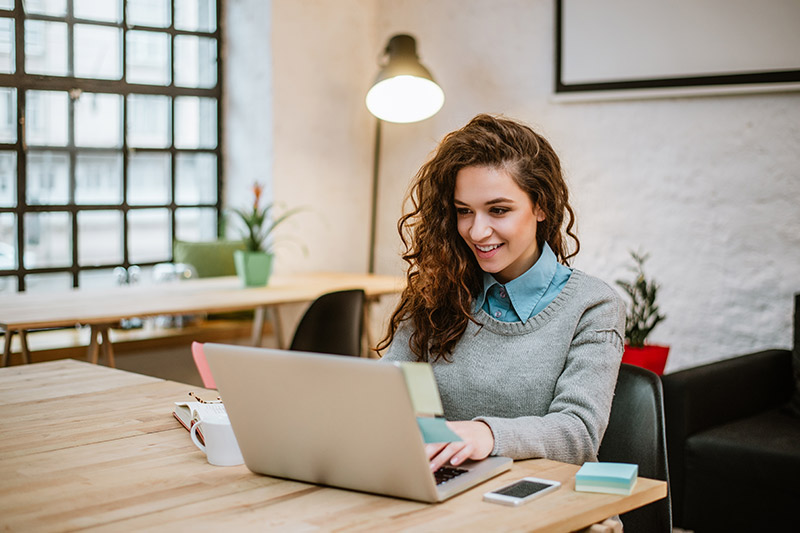 conservatively dressed female business owner at work