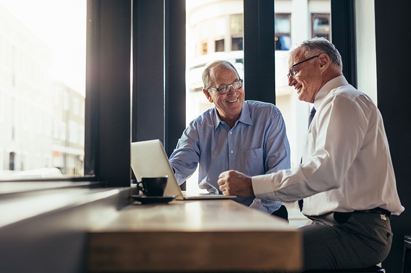 two veteran business owners talking