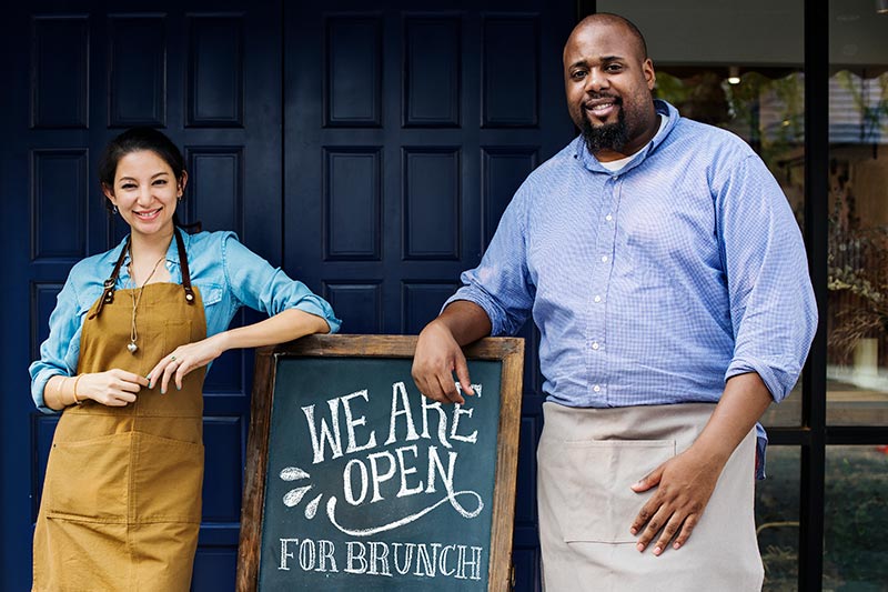 two restaurant owners opening their doors