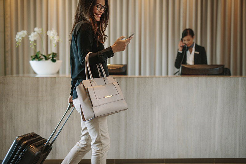 female executive checking into a hotel franchise
