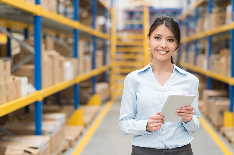 smiling female warehouse manager