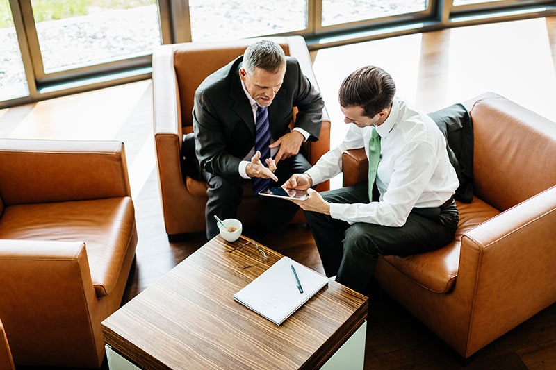 two male sales professionals conducting business