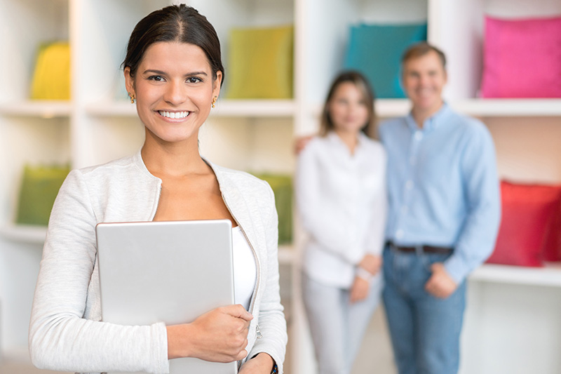 confident retail sales woman with two customers