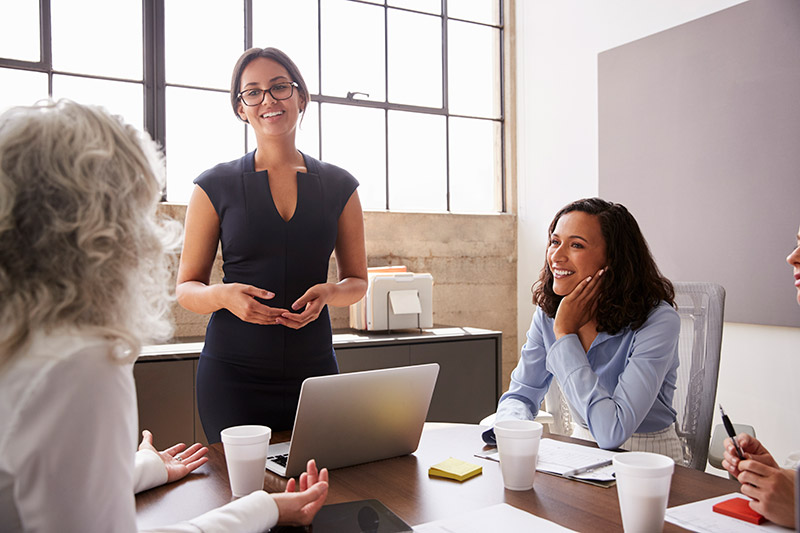 three female executives in a business meeting