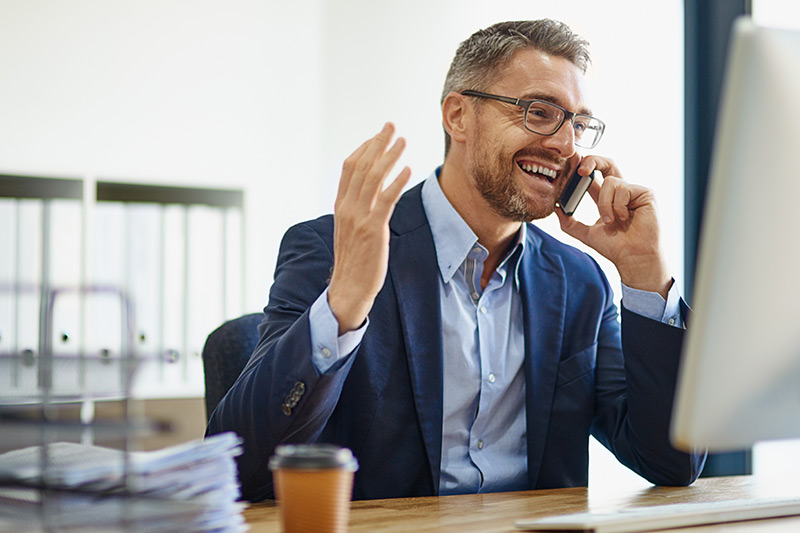 male business owner talking on his mobile phone