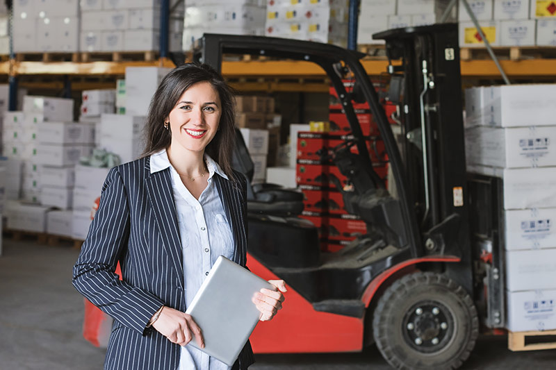female employee near a red forklift