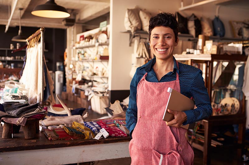 female small business owner standing in her store
