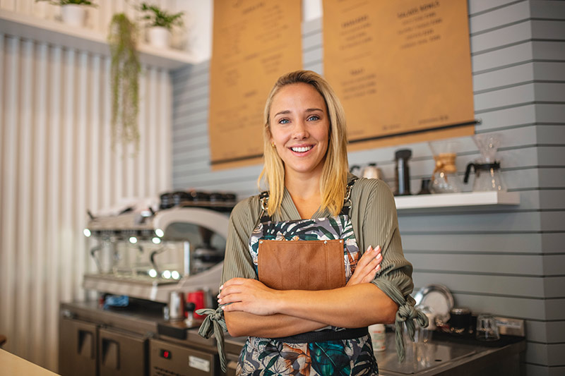smiling female coffee shop owner