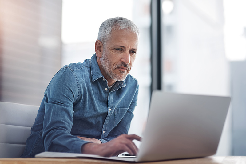 male business owner on his laptop