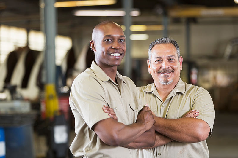 two auto shop business owners in the garage