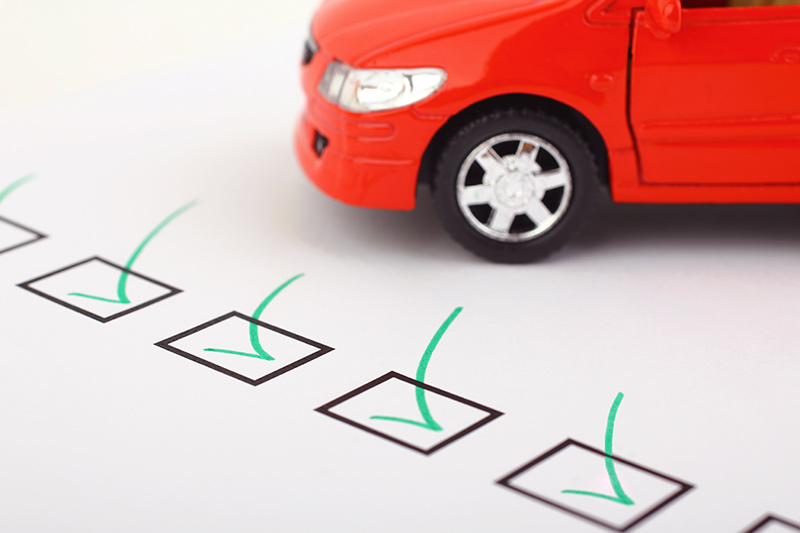 checkbox next to a red business vehicle