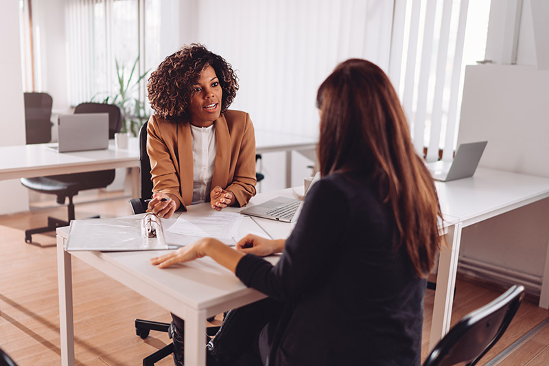two female executives discussing a small business plan