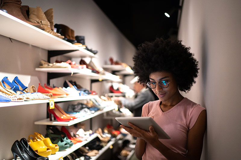 female small business owner checking inventory